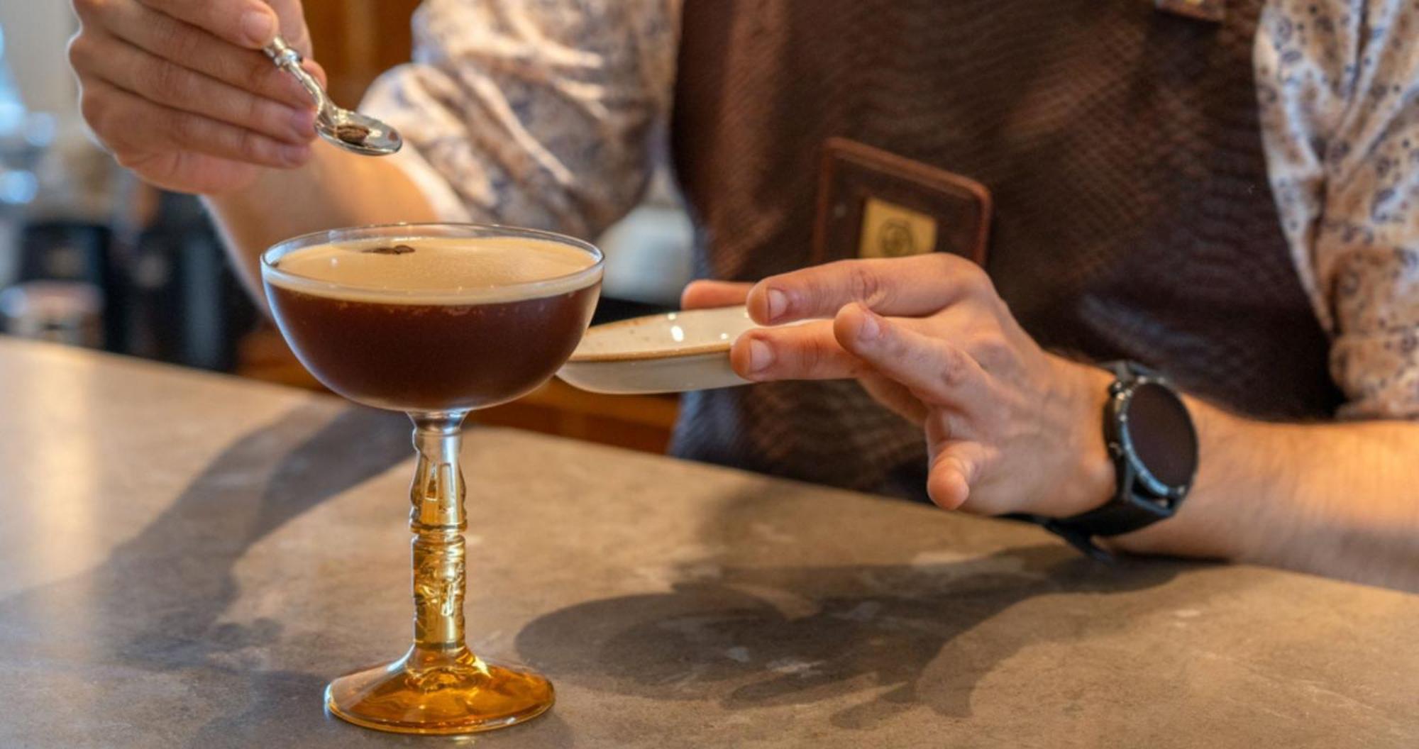 Only You Hotel Sevilla Zewnętrze zdjęcie A bartender adding grated nutmeg to a cocktail